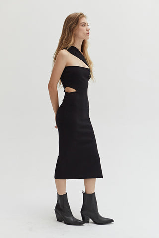 A woman wearing a one shoulder dress with waist cut out.