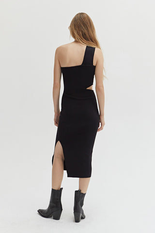 A woman wearing a one shoulder dress with waist cut out.