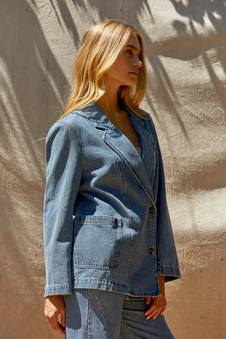 model wearing a denim blazer jacket