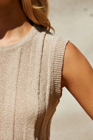 close up of model wearing ribbed sweater knit top