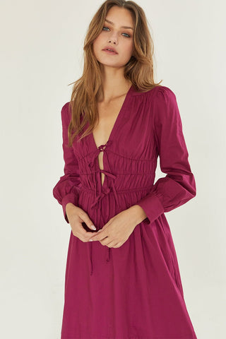 model wearing a berry smocked waist maxi dress