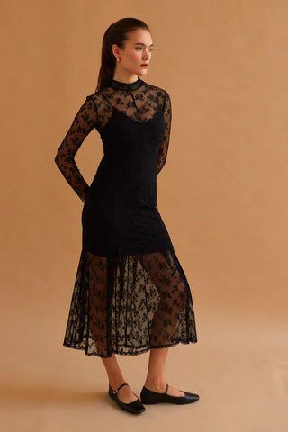 Woman in a black lace dress for New Year’s Eve