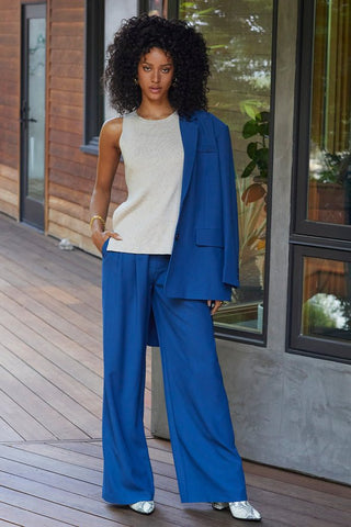 model wearing a blue blazer and wide-leg pants matching set