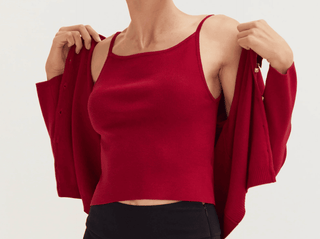 woman in a red cami and cardigan Galentine’s Day outfit idea