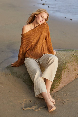 model wearing a knit top and chinos