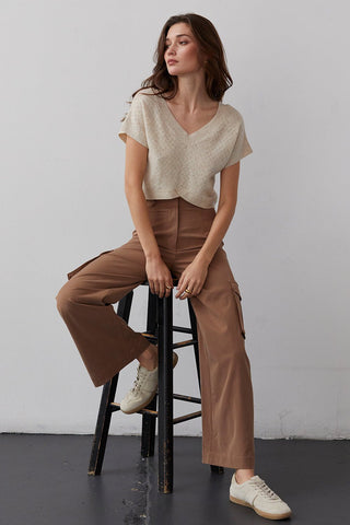 model wearing a knit top with trousers