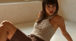 model in neutral sweater tank and pants