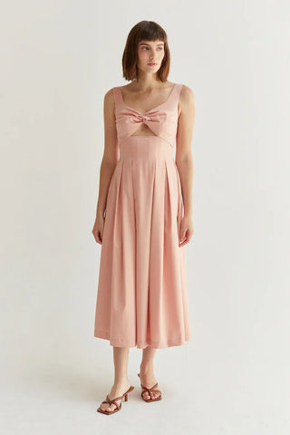 woman in a pink spring wedding guest outfit