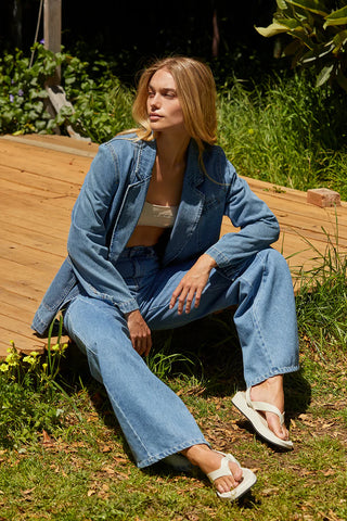 Woman in a denim outfit with spring layering