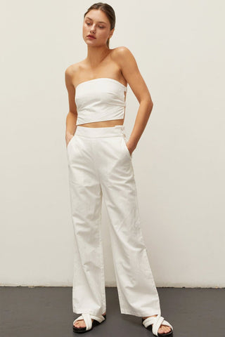 model wearing white bandeau set