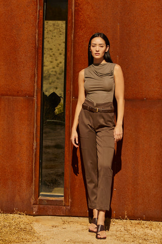 A woman wearing high waisted seam detailed pant. 