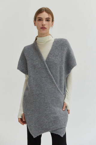 A model wearing a heather grey tunic sweater.