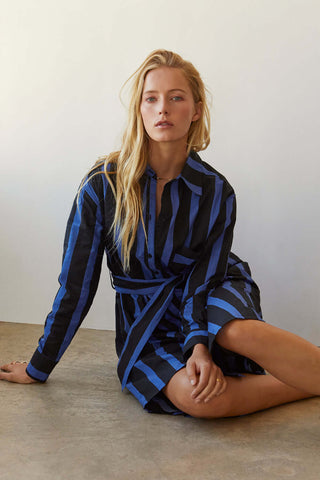 model wearing a black and blue striped shirt dress