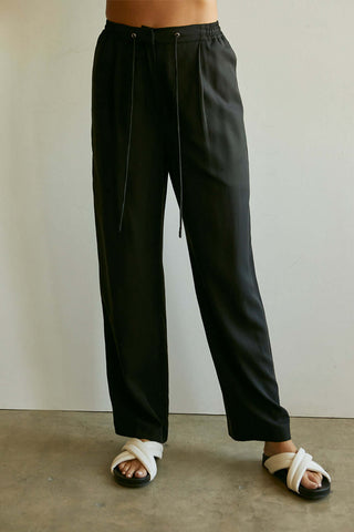 model wearing black elastic waist pants