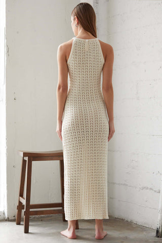 model wearing a cream bodycon sweater dress