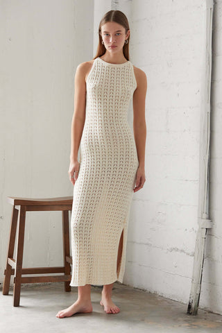 model wearing a cream knit sweater dress