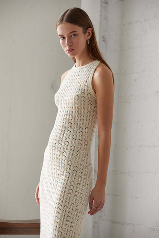 model wearing a cream maxi sweater dress