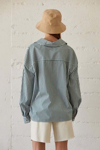 model wearing a drop shoulder pinstripe shirt for women