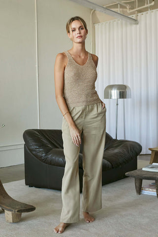 model wearing a tan tencel pants and tank