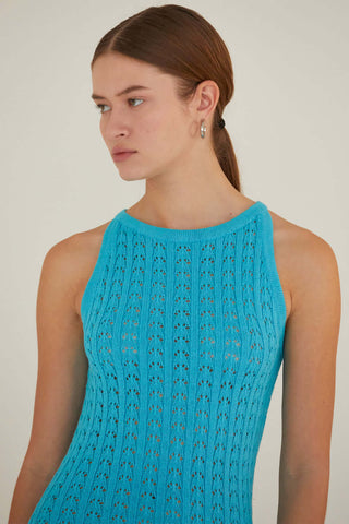 model wearing a teal knit sweater maxi
