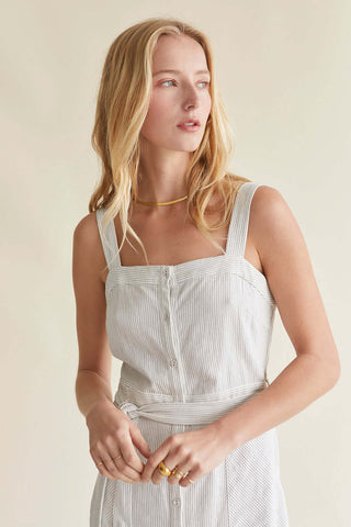 model wearing a white linen blend dress