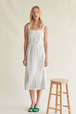 model wearing a white striped linen dress