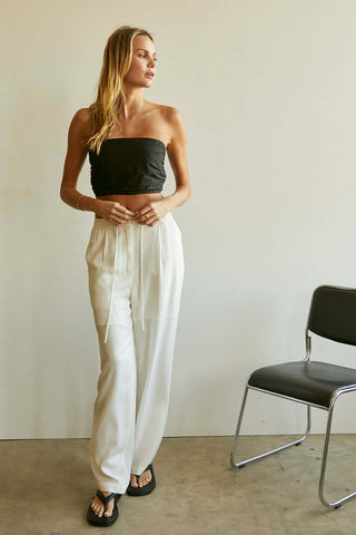 model wearing white women’s tencel pants File 