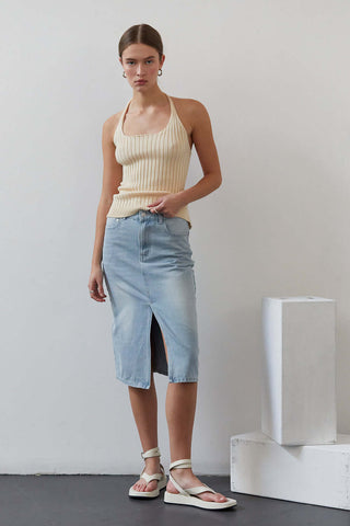 woman in cream top with sandals 
