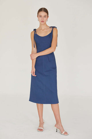 woman in denim dress posing