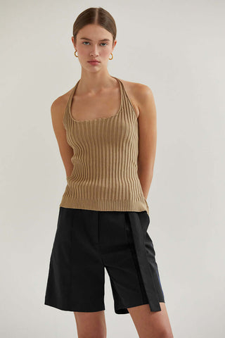 woman in  taupe halter top with facing camera without glasses