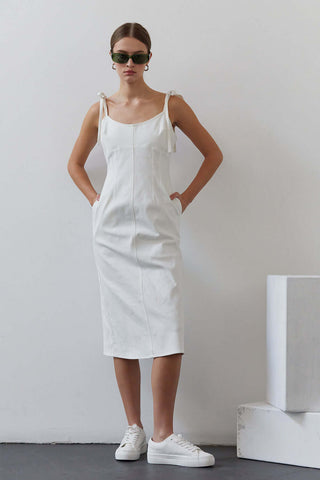 model wearing white denim dress
