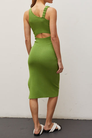 A woman wearing a fern asymmetric shoulder with back cut out midi knit dress.