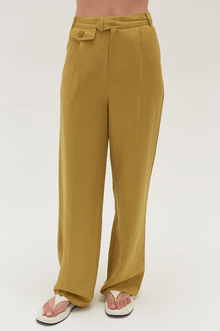 A woman wearing a key lime wide leg trousers.
