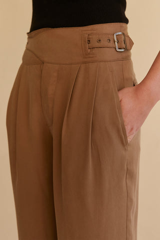 A model wearing a khaki wide leg Tencel trousers.