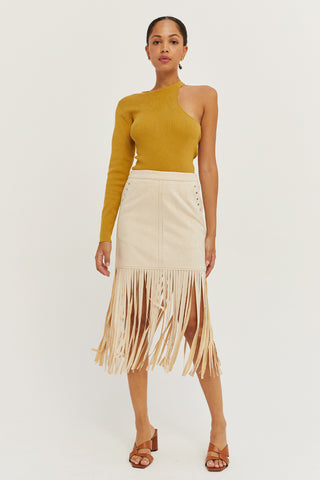 A model wearing a bone fringe suede mini skirt.