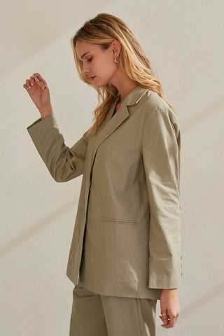 A model wearing a moss blazer set.