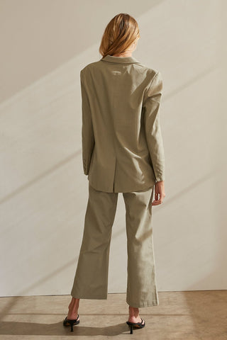 A model wearing a moss blazer set.