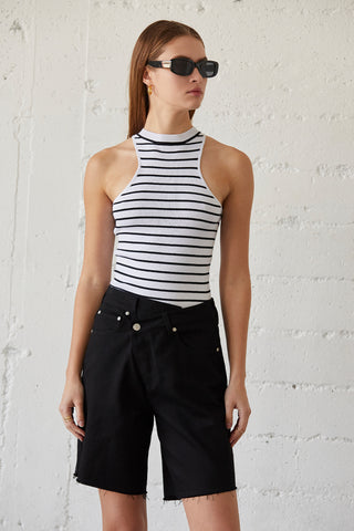 A model wearing a black stripe racer knit top.