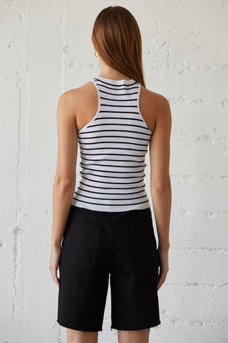 A model wearing a black stripe racer knit top.