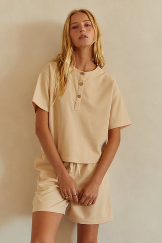 A model wearing a sand waffle knit set.