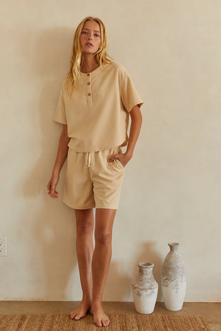 A model wearing a sand waffle knit set.