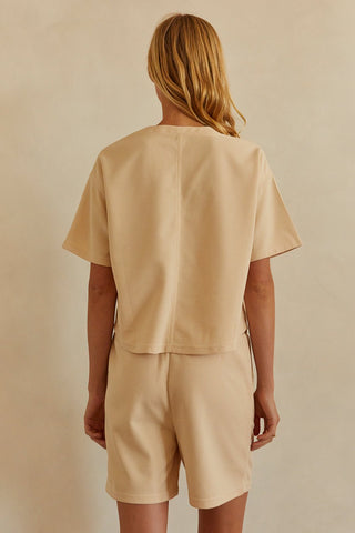A model wearing a sand waffle knit set.