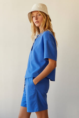 A model wearing a blue waffle knit set.