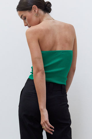 A woman wearing an emerald rib corset top.