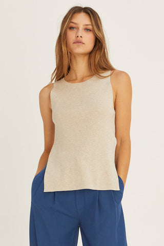 model wearing a beige knit tank top