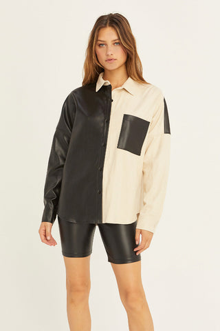 model wearing a black and cream mixed media shirt