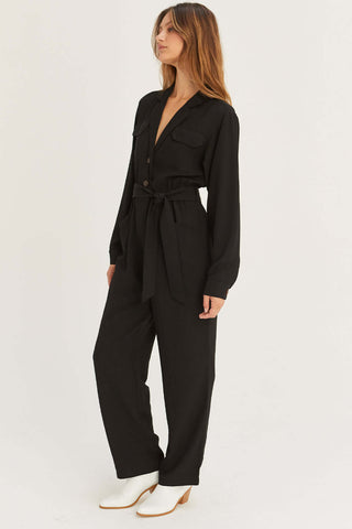 model wearing black v-neck formal jumpsuit