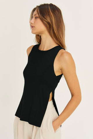 model wearing a black knit tank top