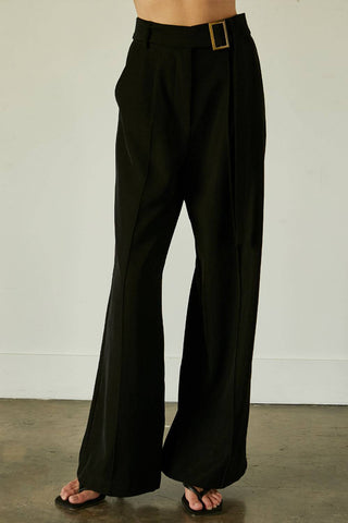 model wearing black high waist trouser with belt