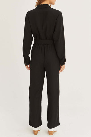 model wearing black relaxed jumpsuit